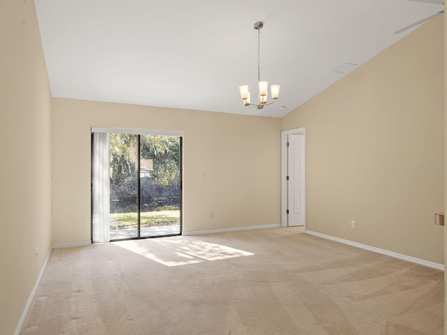 carpeted empty room with ceiling fan with notable chandelier and lofted ceiling