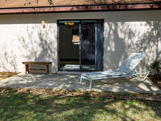 property entrance with a patio