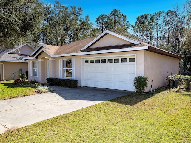 ranch-style home featuring a garage and a front yard