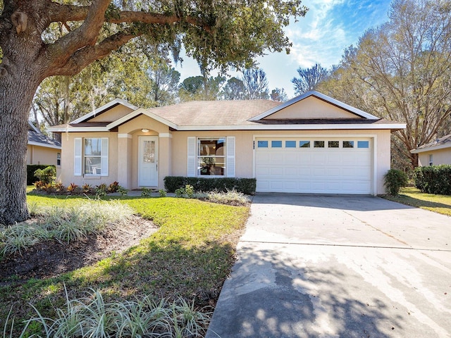 single story home featuring a front yard and a garage