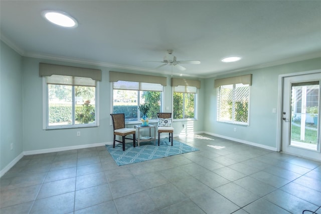 sunroom featuring ceiling fan