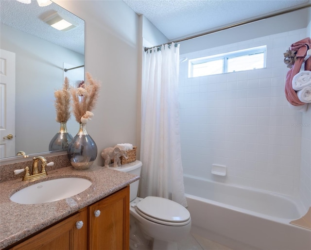 full bathroom with toilet, a textured ceiling, shower / bath combo with shower curtain, and vanity