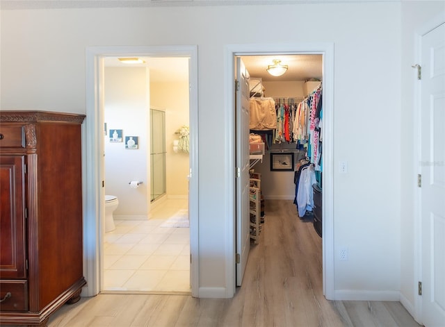 corridor featuring light hardwood / wood-style flooring