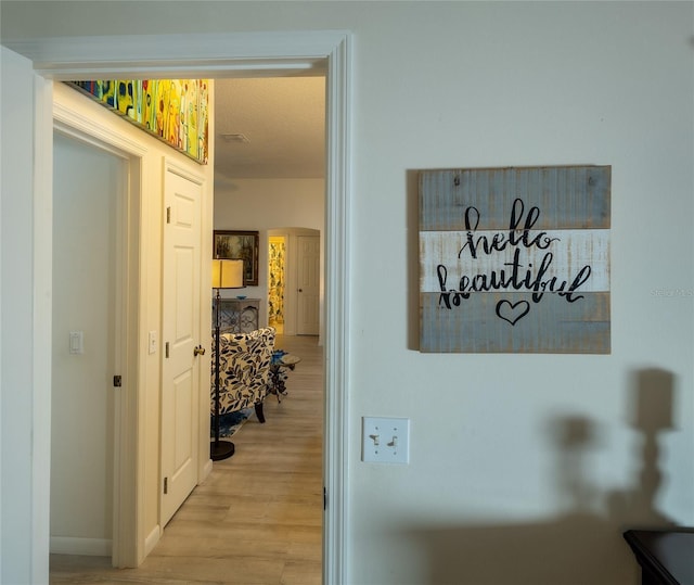 corridor featuring light hardwood / wood-style flooring