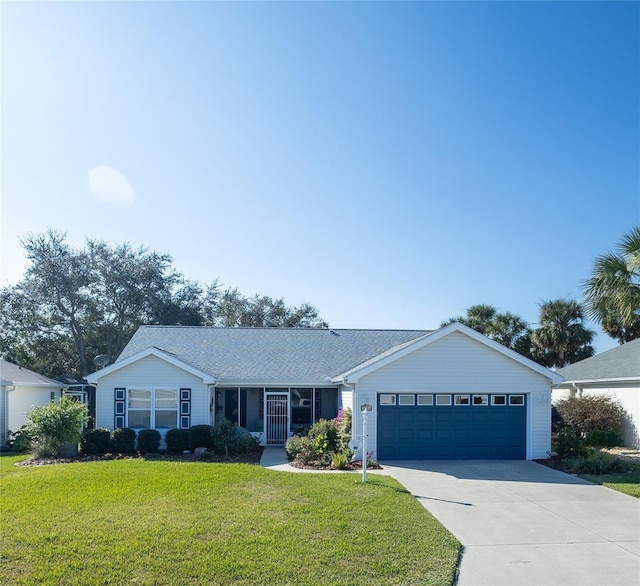 ranch-style house featuring a front yard and a garage