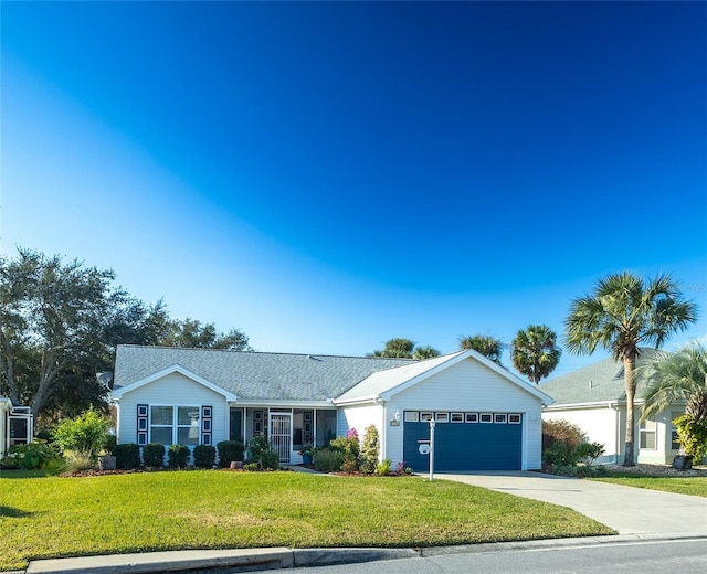 ranch-style home with a front yard and a garage