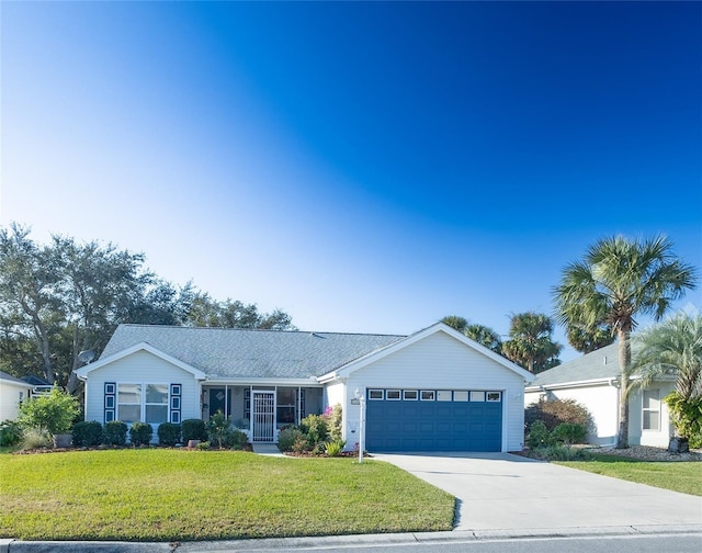 ranch-style house featuring a front lawn and a garage