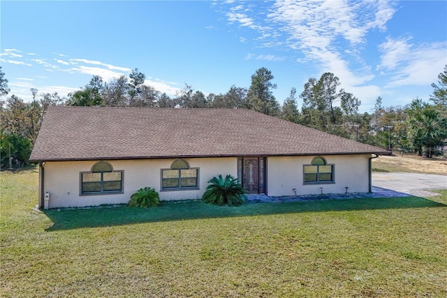 single story home featuring a front lawn