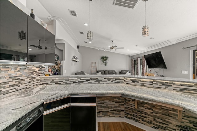 kitchen with hardwood / wood-style flooring, ceiling fan, dishwasher, and a textured ceiling