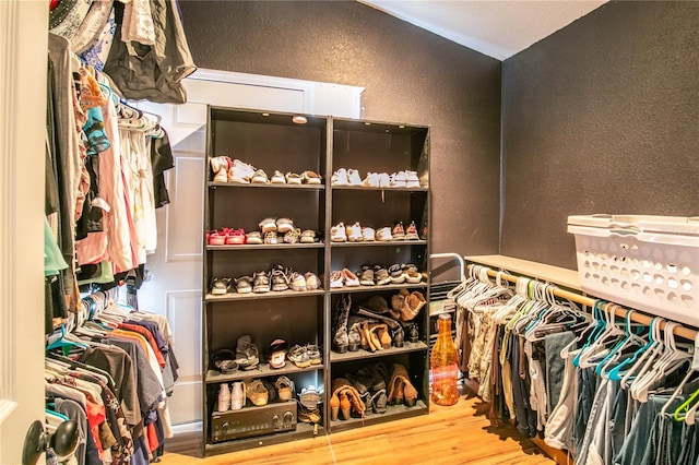 walk in closet featuring hardwood / wood-style floors