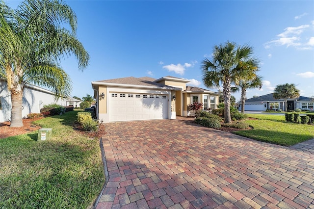 view of front of property with a garage and a front yard