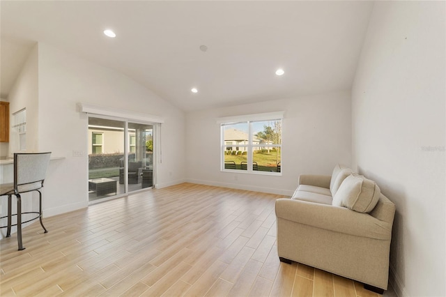 sitting room featuring lofted ceiling