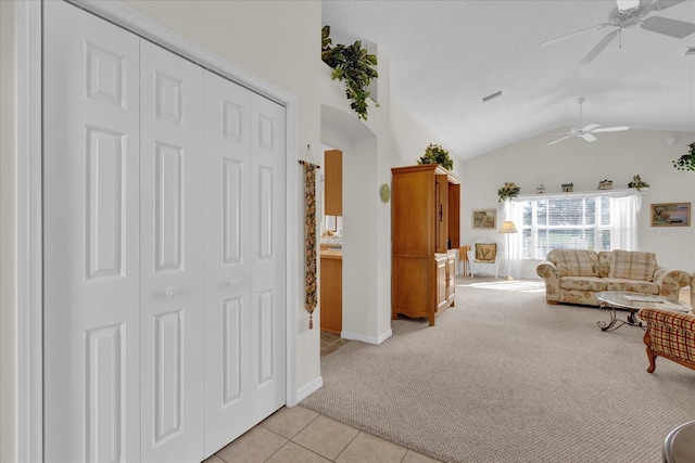 carpeted living room featuring lofted ceiling