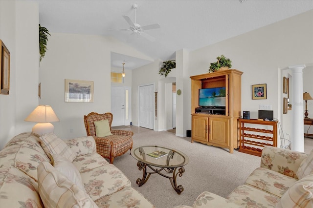 carpeted living room with high vaulted ceiling, ornate columns, and ceiling fan