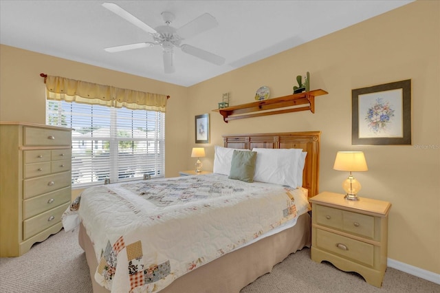 bedroom featuring light carpet and ceiling fan