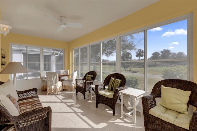 sunroom / solarium featuring ceiling fan