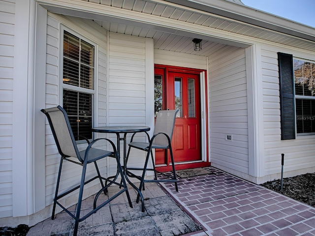 property entrance featuring covered porch