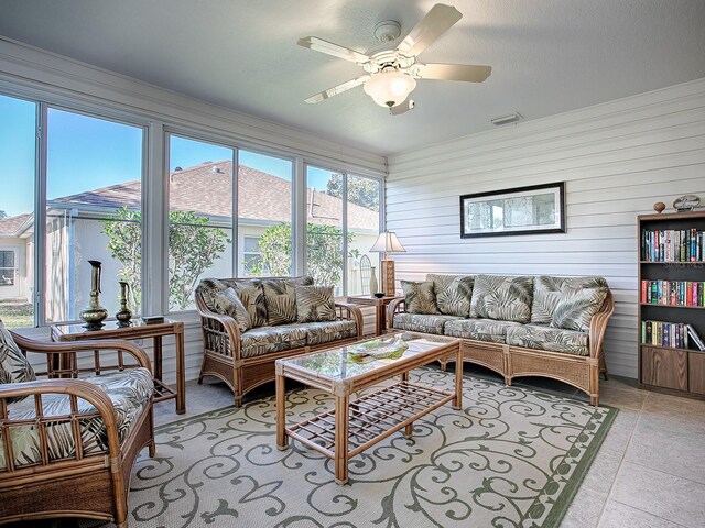 sunroom / solarium with ceiling fan