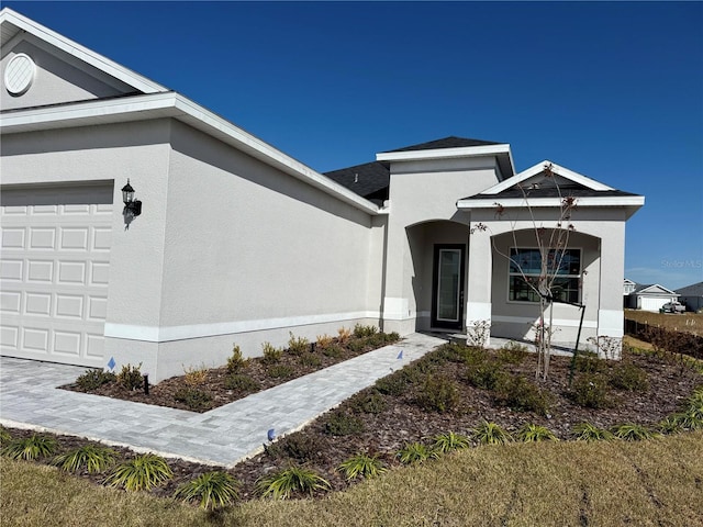 view of exterior entry with a garage