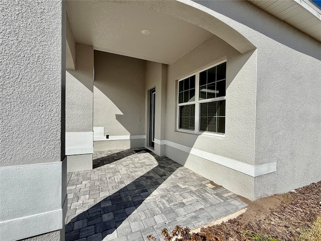 doorway to property featuring a patio