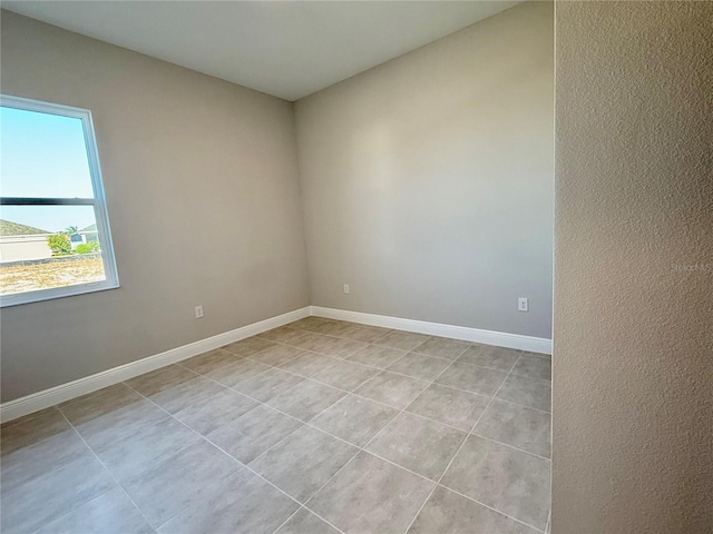 empty room with light tile patterned floors