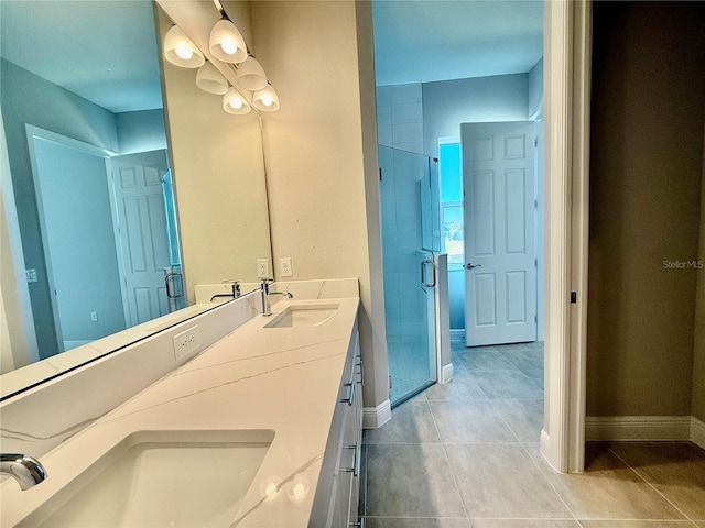 bathroom with vanity and a shower with shower door