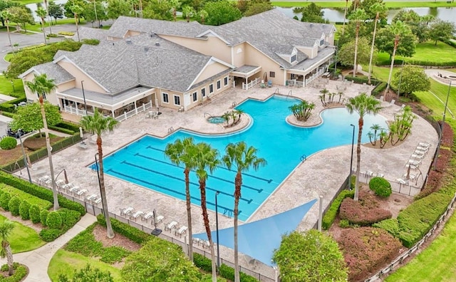 view of swimming pool featuring a water view