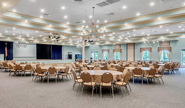 dining area featuring carpet flooring and a raised ceiling