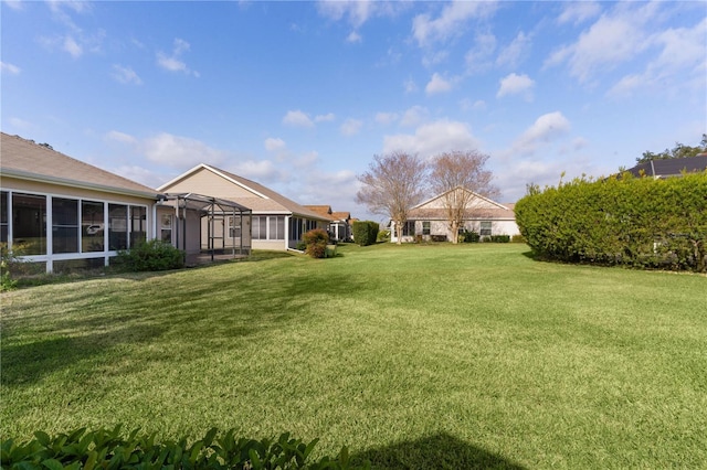 view of yard with a lanai