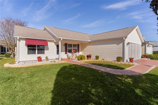 single story home featuring a garage and a front yard