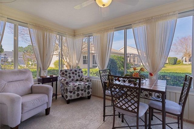 sunroom / solarium with ceiling fan and a wealth of natural light