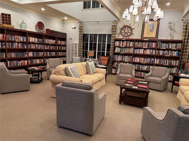 carpeted living room with an inviting chandelier and ornamental molding