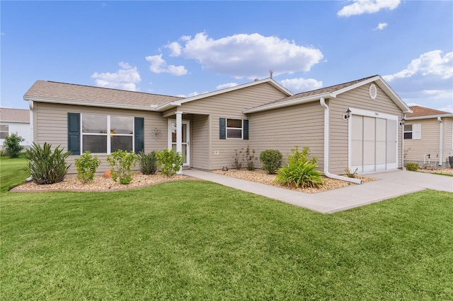 ranch-style home featuring a garage and a front lawn