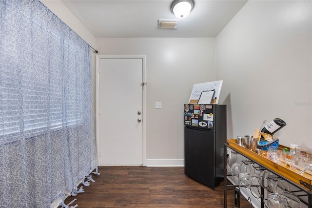 entryway with dark wood-type flooring