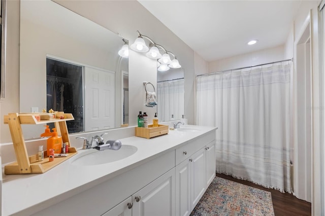 bathroom featuring a shower with shower curtain, vanity, and hardwood / wood-style floors