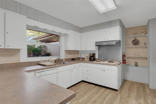 kitchen with white cabinetry, white appliances, light hardwood / wood-style flooring, and a textured ceiling