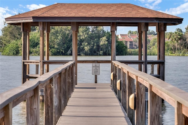 view of dock featuring a water view and a gazebo