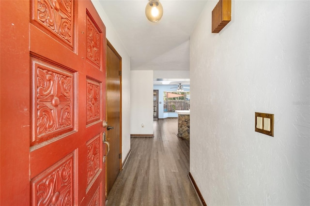hallway featuring dark hardwood / wood-style floors