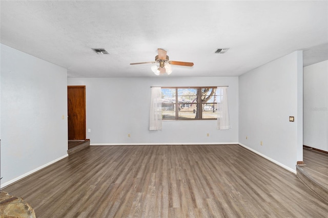empty room featuring wood-type flooring and ceiling fan