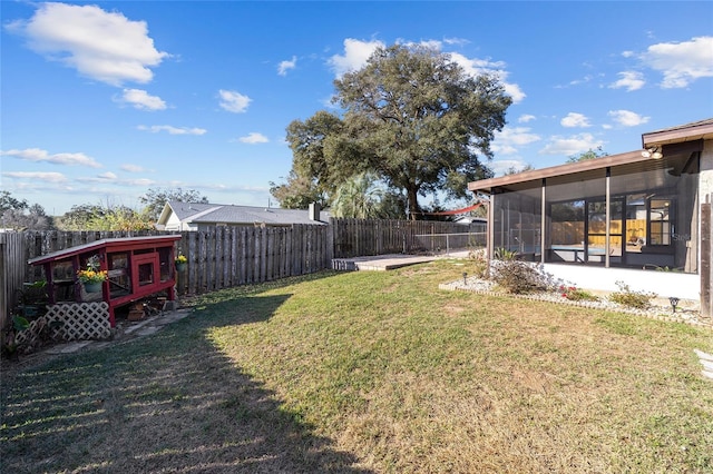 view of yard with a sunroom