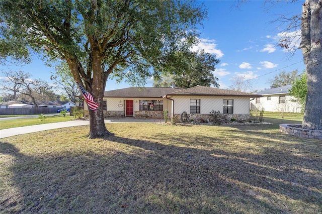 ranch-style house with a front lawn