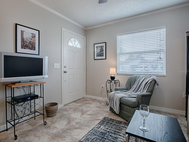 entrance foyer with crown molding and a textured ceiling