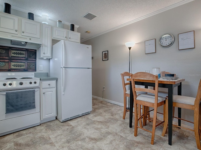 kitchen with ornamental molding, a textured ceiling, white appliances, exhaust hood, and white cabinets