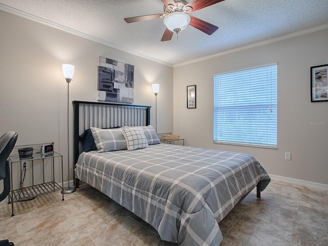 bedroom featuring a textured ceiling, ceiling fan, and ornamental molding