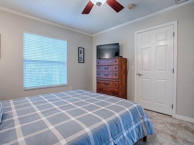 bedroom with multiple windows, a textured ceiling, ceiling fan, and crown molding