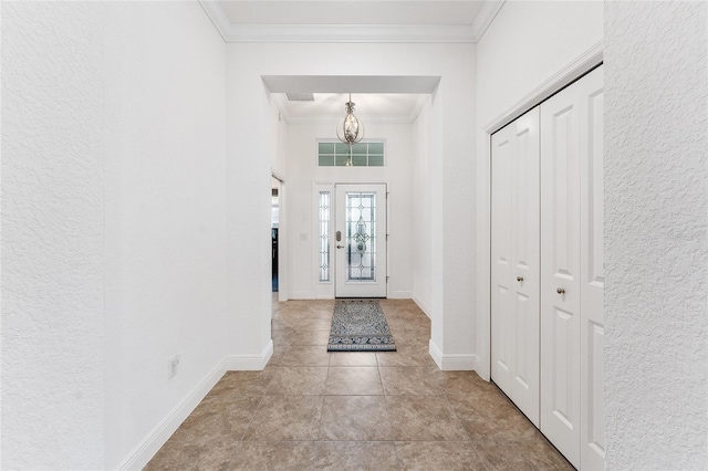 foyer entrance featuring ornamental molding