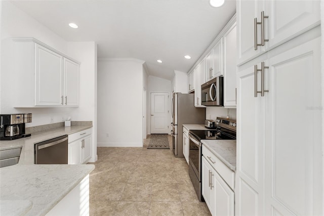 kitchen featuring light stone countertops, white cabinets, appliances with stainless steel finishes, and crown molding