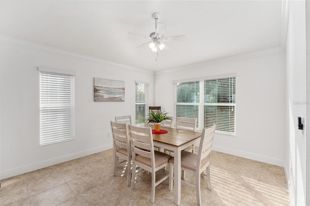 dining space featuring ceiling fan, light tile patterned flooring, and crown molding