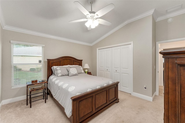 bedroom featuring light carpet, ceiling fan, a closet, vaulted ceiling, and ornamental molding