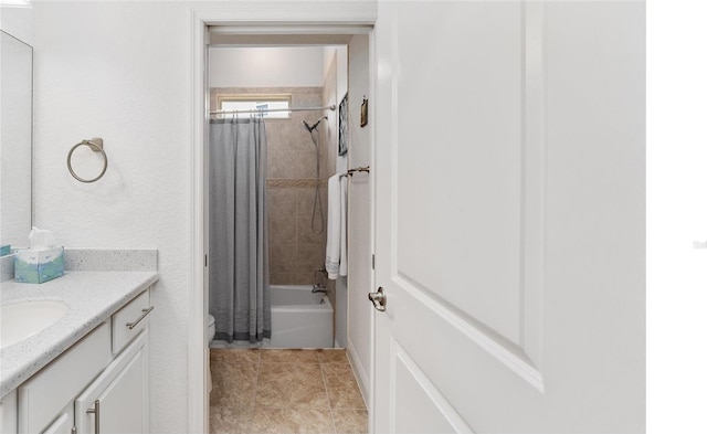 full bathroom with toilet, vanity, and shower / bath combo with shower curtain